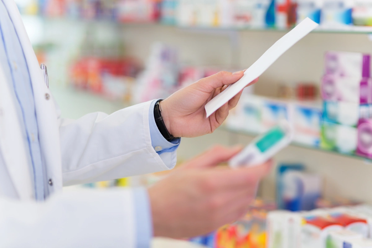 pharmacist completing a prescription